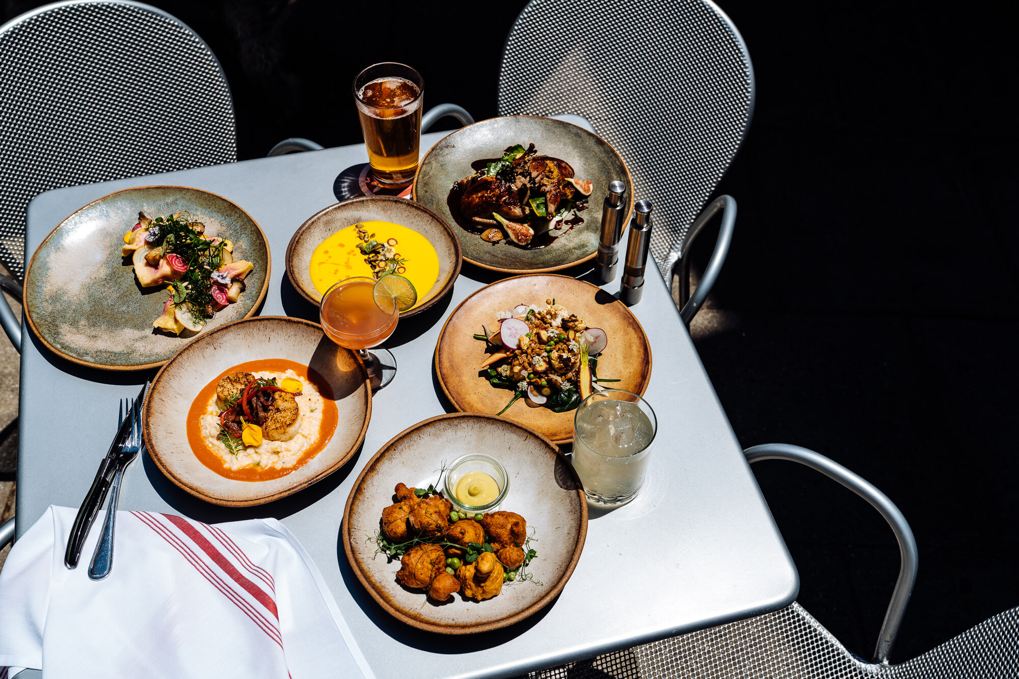 The Market Place signature dishes The menu is seasonal and changes frequently. Past dishes include Pan-Seared Scallops, Heritage Pork Chop, and seasonal vegetable plates.